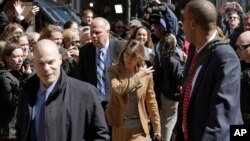 FILE - Fans photograph actress Lori Loughlin as she arrives at federal court in Boston, Massachusetts, April 3, 2019, to face charges in a nationwide college admissions bribery scandal.
