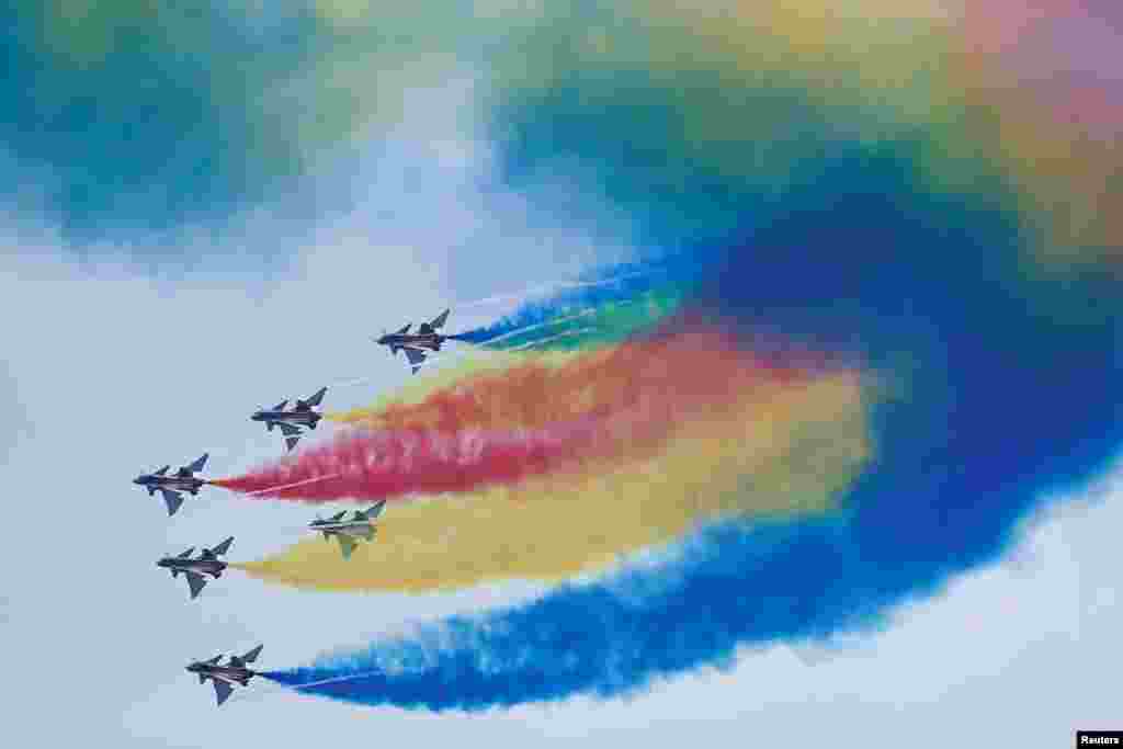 Aircraft of the Chinese People's Liberation Army (PLA) Air Force's Bayi aerobatic team perform at the China International Aviation and Aerospace Exhibition, or Airshow China, in Zhuhai, Guangdong province, China.