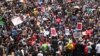 Hundreds of demonstrators gather at the end of a protest march across the Nelson Mandela bridge into Johannesburg, Dec. 16, 2015. The protesters were calling for President Jacob Zuma to be removed.