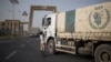 FILE - A convoy of aid trucks to Ethiopia's Tigray region leaves the outskirts of Semera, Afar region, Ethiopia, on May 15, 2022.