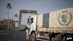 FILE - A 130 trucks aid convoy to Tigray region leaves the outskirts of Semera, Afar region, Ethiopia. The World Food Program said its first aid convoy had arrived in the war-torn region on Nov. 16, 2022.
