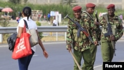 FILE - Members of the General Service Unit (GSU) patrol a section of an overpass in Kenya's capital, Nairobi, July 24, 2015. 