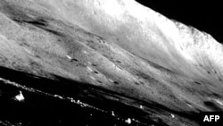 This handout photo released on Feb.1, 2024 from the Japan Aerospace Exploration Agency (JAXA) shows the last scene of the Moon taken by the Smart Lander for Investigating Moon (SLIM) with its navigation camera before dusk.