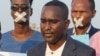 Secretary-general of the Somali Journalists Syndicate Abdalle Ahmed Mumin, center, is seen in an undated photo from his Twitter.