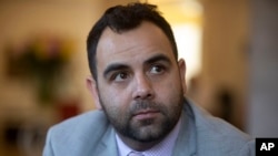 Human Rights Watch researcher Omar Shakir sits during an interview in Jerusalem, Nov. 24, 2019.