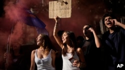 FILE — Protesters shout during a demonstration in Marseille, southern France, Oct. 18, 2022
