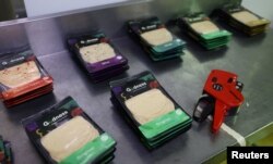 Plant-based polony used as an alternative or meat substitute is placed on the table before being labelled at meat processor Feinschmecker, in Germiston, in the East Rand region of Johannesburg, South Africa, Oct. 11, 2022.