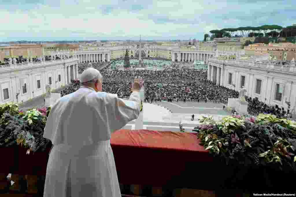 Pope Francis delivers his traditional Christmas Day Urbi et Orbi message to the city and the world from the main balcony of St. Peter's Basilica at the Vatican, Dec. 25, 2023.