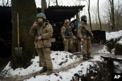 Soldiers of Ukraine's state border guard rest in Sumy region, Ukraine, Nov. 24, 2023. Nearly two years into the Russian invasion of Ukraine, instead of common crossing points between the countries, there are now military positions separated by the border.
