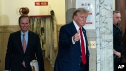 FILE - Former President Donald Trump gives a thumbs up as he returns to the courtroom from a break at New York Supreme Court, in New York City, Dec. 7, 2023.