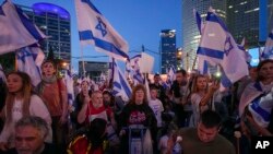 Israelis protest plans by Prime Minister Benjamin Netanyahu's government to overhaul the judicial system in Tel Aviv, Israel, April 22, 2023. (AP Photo/Tsafrir Abayov)