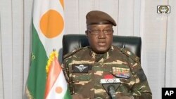FILE — In this image from a video provided by ORTN, General Abdourahmane Tchiani makes a statement in Niamey, Niger, July 28, 2023. On Saturday, he said those who ousted Niger's democratically elected president will return the country to civilian rule within three years.