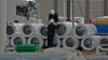 China's July Factory Output Shrinks, Adds Pressure to End Economic Slump 
