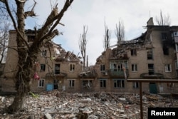 FILE - A residential building damaged by a Russian military strike is seen in the front-line city of Avdiivka, in Donetsk region, Ukraine, March 20, 2023.