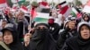 FILE - Muslim women wave Palestinian and Indonesian flags during a rally supporting the Palestinians in Jakarta, Indonesia, Oct. 15, 2023.