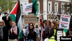 People demonstrate outside the Peace Palace in The Hague, Netherlands, in support of Palestinians on the day Nicaragua asked the International Court of Justice to order Berlin to halt military arms exports to Israel, April 8, 2024. 