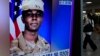 Sebuah layar TV di Stasiun Kereta Api di Seoul, Korea Selatan, menayangkan berita tentang tentara Amerika Travis King, Senin, 24 Juli 2023. (AP/Ahn Young-joon)