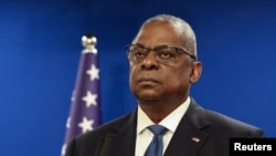 FILE - US Secretary of Defense Lloyd Austin looks on during a joint press conference with Israeli Defense Minister Yoav Gallant at Israel's Ministry of Defense in Tel Aviv, Israel, Dec. 18, 2023.