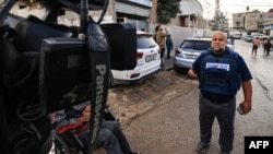 FILE - Al Jazeera's Gaza bureau chief Wael al-Dahdouh works in Rafah in the southern Gaza Strip, Dec. 12, 2023, amid continuing battles between Israel and the Palestinian Hamas militant group.