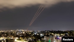 FILE - An anti-missile system is activated after Iran launched drones and missiles towards Israel, as seen from Ashkelon, Israel, April 14, 2024. 