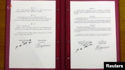 6월 19일 블라디미르 푸틴 러시아 대통령과 김정은 북한 국무위원장이 서명한 포괄적 전략 동반자 관계에 관한 조약 문서.
