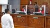 Kuat Ma'ruf (membelakangi), mendengar putusan vonis hukuman yang dibacakan oleh Hakim Ketua Wahyu Iman Santosa dalam sidang yang digelar pada Selasa (14/2) di Pengadilan Negeri Jakarta Selatan. Kuat divonis 15 tahun penjara oleh majelis hakim. (VOA/Indra Yoga)
