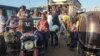 FILE — People displaced by the conflict in Sudan flee Wad Madani, the capital of al-Jazirah state, heading to Gadaref state, Dec. 16, 2023. 
