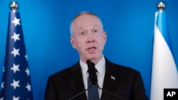 FILE - Israeli Defense Minister Yoav Gallant speaks at Ben Gurion International Airport, March 9, 2023, in Lod, Israel. 
