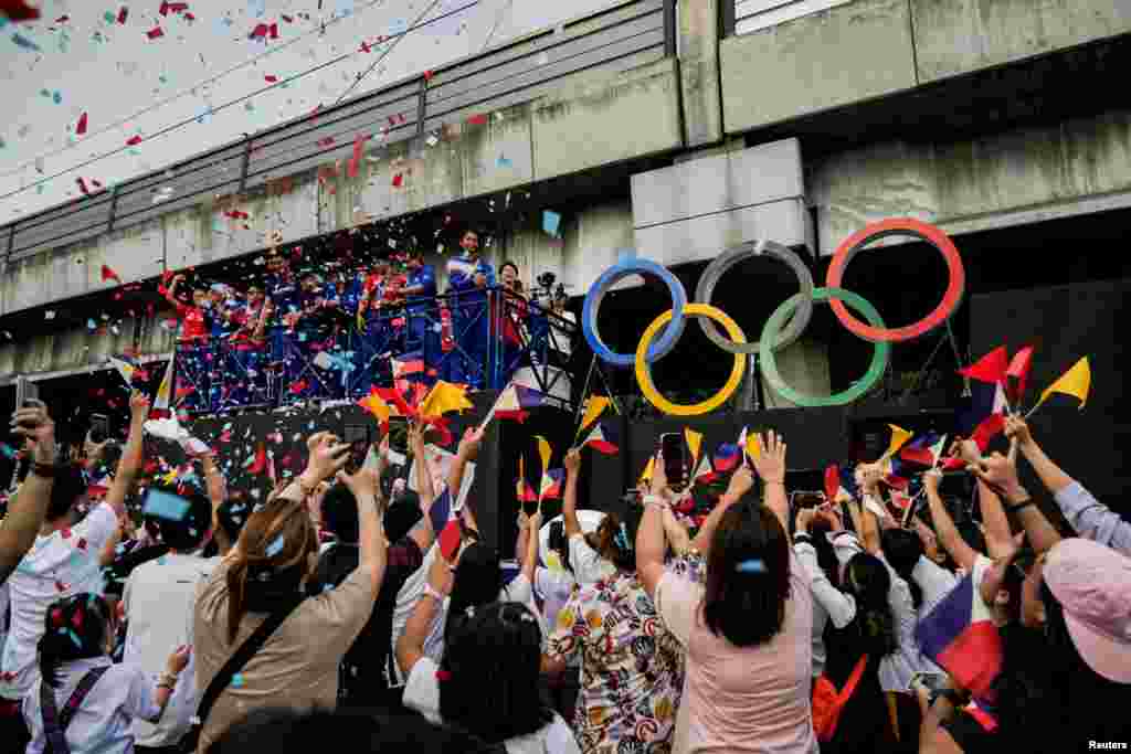 Filipino gymnast Carlos Edriel Yulo, who won gold medals in men's floor exercise and men's vault at the Olympics, joins a welcoming parade for Filipino athletes who competed at the Paris 2024 Olympics, in Manila, Philippines.