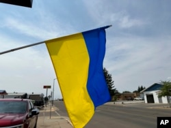 A Ukrainian flag flies outside the Ukrainian Cultural Institute in Dickinson, N.D., July 17, 2023. The institute preserves the area's Ukrainian heritage with its museum, library and meals.