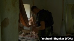 Ukrainian soldiers take shelter within the battle zone on in Storozheve, Ukraine, June 23, 2023.