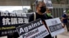 Hong Kong Police Arrest Union Leader Following Visit to Imprisoned Husband