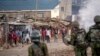 Protesters shout at police as they demonstrate in the Kibera slum of Nairobi, Kenya, March 20, 2023.