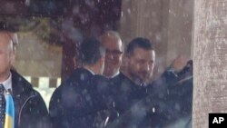 Ukrainian President Zelenskyy, right, leaves his hotel for a meeting with Italian President Sergio Mattarella, May 13, 2023. Zelenskyy to later meet with the pope at The Vatican.