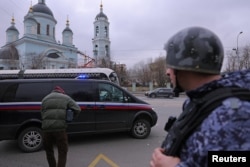 FILE - A vehicle carrying Wall Street Journal reporter Evan Gershkovich, detained on suspicion of espionage, drives away from a court building in Moscow, Russia, March 30, 2023.