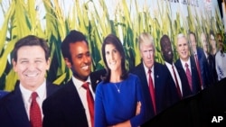 FILE - A poster of candidates competing for the Republican nomination is seen at the Iowa State Fair, in Des Moines, Iowa, Aug. 18, 2023.