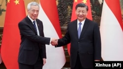 資料照片: 中國領導人習近平在北京會面的新加坡總理李顯龍（2023年3月31日）