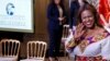 Meaza Mohammed from Ethiopia waves as she leaves the East Room of the White House after being honored at the 17th annual International Women of Courage (IWOC) Award Ceremony at the White House, March 8, 2023. 