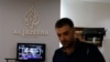 FILE - An employee of Qatar-based news channel Al Jazeera is seen at the media outlet's offices in Jerusalem, July 31, 2017.