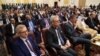 FILE - Aidan O'Hara, left, E.U. ambassador to Sudan, attends the signing ceremony of an initial deal between military and civilian leaders in Khartoum, Sudan, on Dec. 5, 2022. 