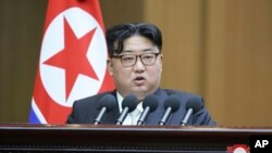 In this photo provided by the North Korean government, North Korean leader Kim Jong Un speaks at the Supreme People’s Assembly in Pyongyang, North Korea, Jan. 15, 2024. 