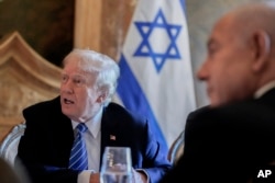 Republican presidential nominee Donald Trump meets with Israeli Prime Minister Benjamin Netanyahu at his Mar-a-Lago estate, July 26, 2024, in Palm Beach, Fla.