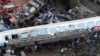 FILE - Firefighters and rescuers operate after a collision in Tempe near Larissa city, Greece, March 1, 2023. 