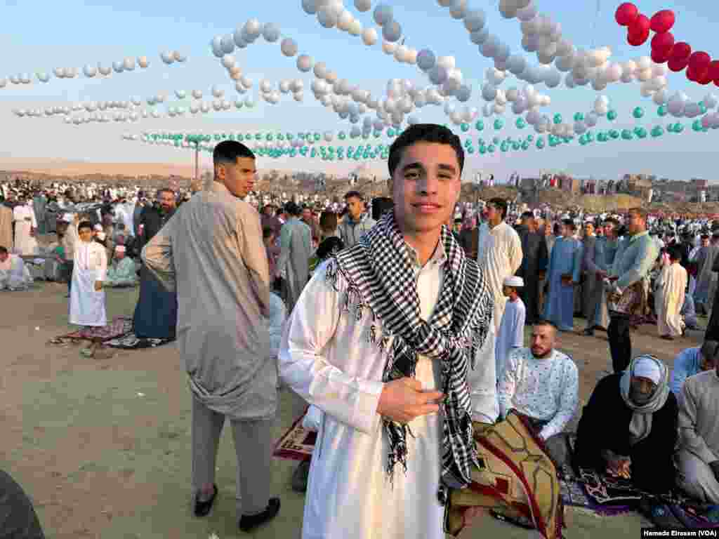 “I’m sure when my Palestinian friends on Facebook see me taking a photo with the keffiyeh and these balloons, they’ll know we care about them, too,” says Mohamed, a high school student. Abusir, Egypt, April 10, 2024.