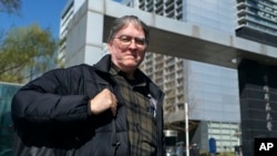 David Moser, an American and associate professor at Capital Normal University in Beijing, poses for a photo at the university, March 22, 2024, in Beijing.