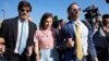 FILE - Amanda Knox arrives with her husband Christopher Robinson, right, and her lawyer Luca Luparia Donati at the Florence courtroom in Florence, Italy, June 5, 2024. 