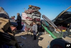 Displaced Palestinians arrive in central Gaza after fleeing from the southern Gaza city of Rafah in Deir al-Balah, Gaza Strip, May 8, 2024. The Israeli army has ordered tens of thousands of people to evacuate Rafah as it conducts a ground operation there.