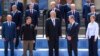 Britain's Prime Minister Keir Starmer, second right, and Ukrainian President Volodymyr Zelenskyy, second left, pose for a photo with other leaders during the European Political Community Summit at Blenheim Palace in Woodstock, Britain, July 18, 2024.