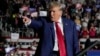 FILE - Republican presidential candidate and former President Donald Trump arrives for a campaign rally in Erie, Pennsylvania, July 29, 2023.
