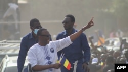 FILE - Success Masra gestures as he arrives for a meeting of the Chadian political party of the Chadian political party The Transformers, in NDjamena on March 10, 2024.